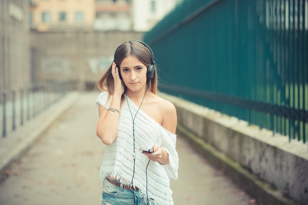 young beautiful woman girl autumn listening music