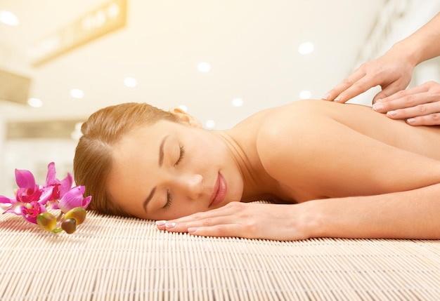 Young beautiful woman having treatment in spa salon