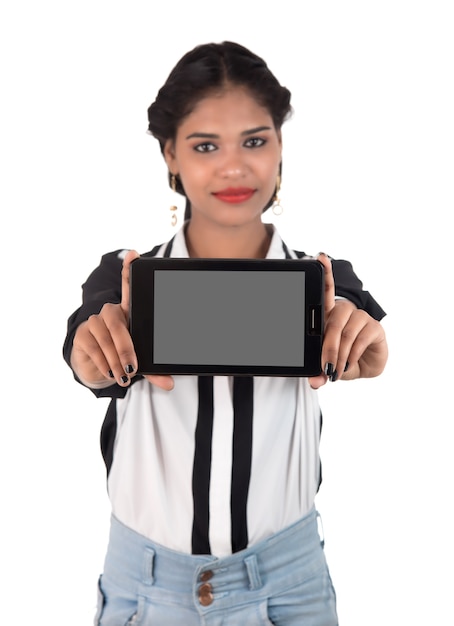 Young beautiful woman holding blank screen smart phone