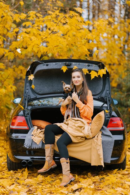 A young beautiful woman holds her beloved pet