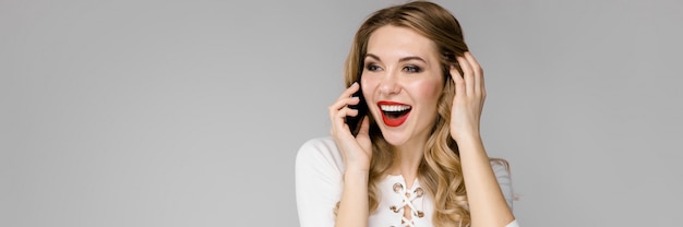Young beautiful woman is calling by phone