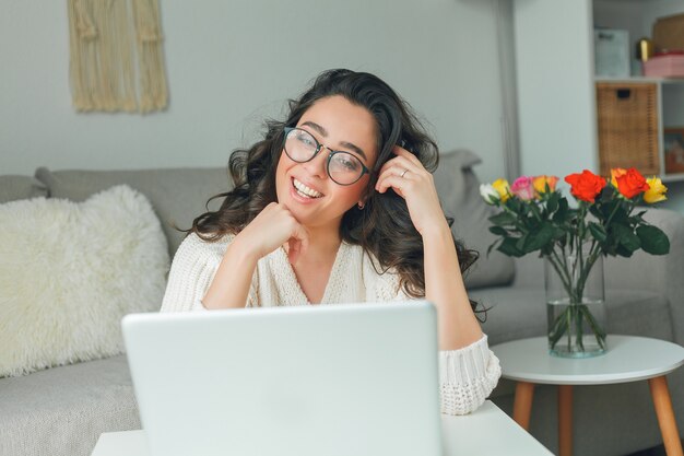 Young beautiful woman is shopping online. Working on the Internet. Home Office. Covid19.