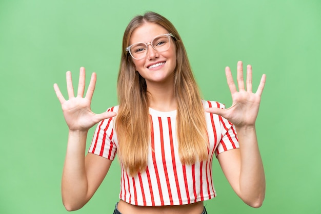 Young beautiful woman over isolated background counting ten with fingers