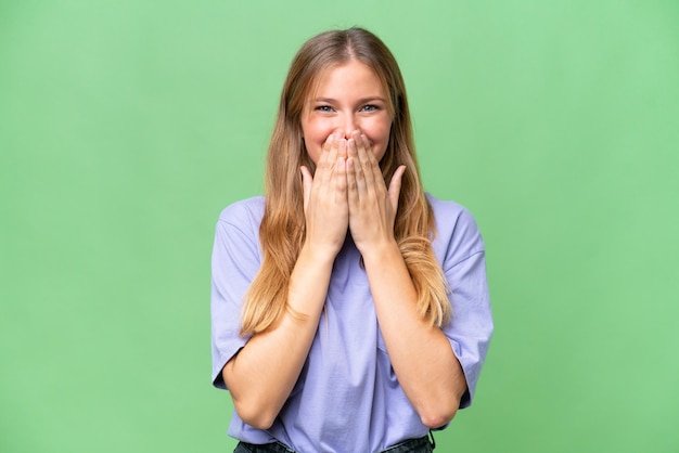 Young beautiful woman over isolated background happy and smiling covering mouth with hands