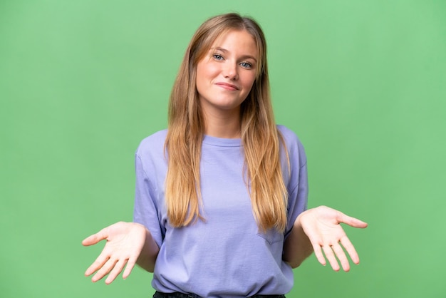 Young beautiful woman over isolated background having doubts
