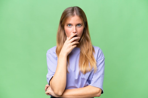 Young beautiful woman over isolated background surprised and shocked while looking right