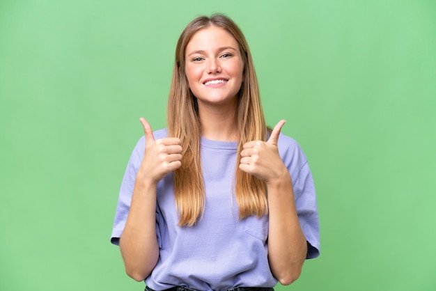 Young beautiful woman over isolated background with thumbs up gesture and smiling