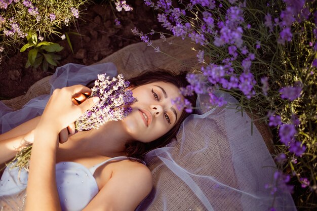 Young beautiful woman in a lavender field