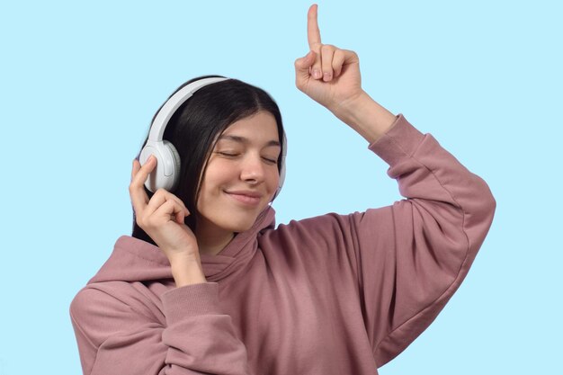 Young beautiful woman listening to music