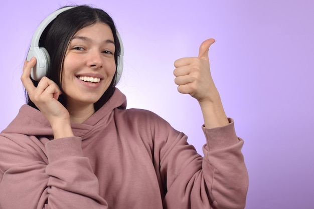 Young beautiful woman listening to music