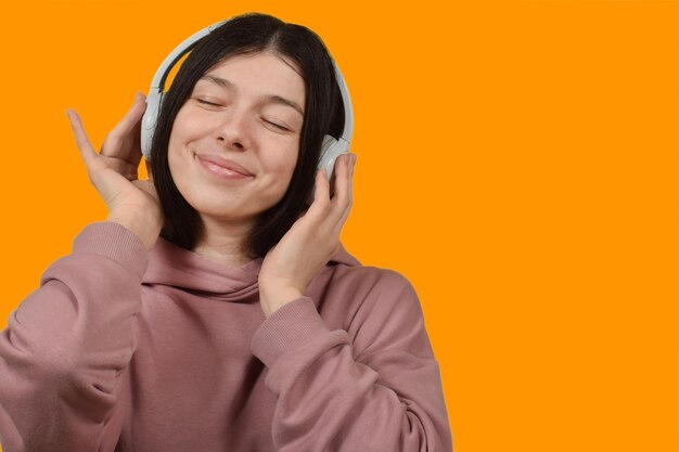 Young beautiful woman listening to music