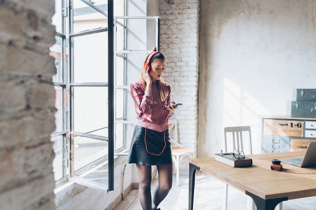 Young beautiful woman listening to some music 