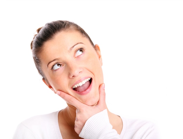 a young beautiful woman lost in her thoughts over white background