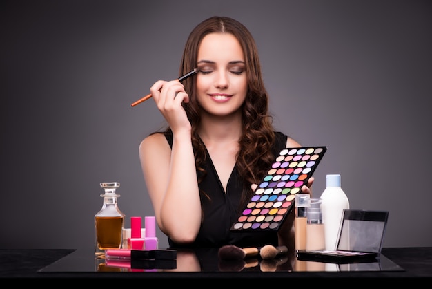 Young beautiful woman during make-up session