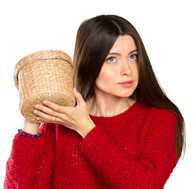 Young beautiful woman opening a wooden box