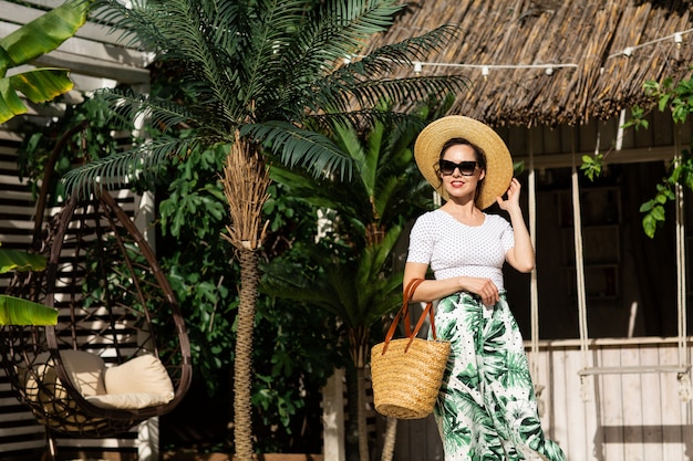 Young beautiful woman outdoors in balinese resort