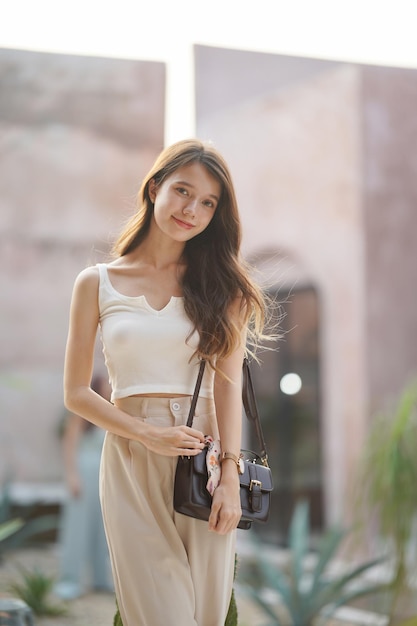 Young beautiful woman posing indoor, Fashionable Portrait Of A Beautiful Woman In A Tropical Villa.