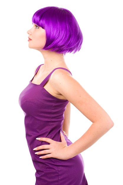 Young beautiful woman in purple wig and dress