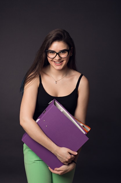 Young beautiful woman reading documents