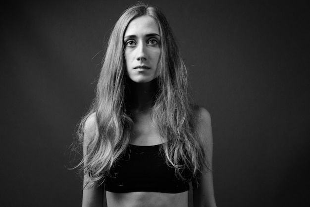 Young beautiful woman ready for gym in black and white