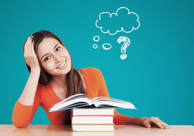 Young beautiful woman in red sweater reading books