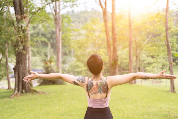 Young beautiful woman relax after exercise in park