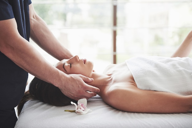 Young beautiful woman relaxing from the massage face