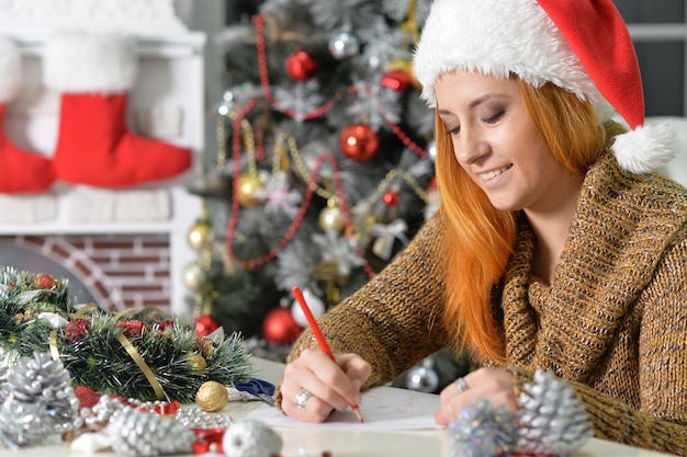 Young beautiful woman in Santa hat