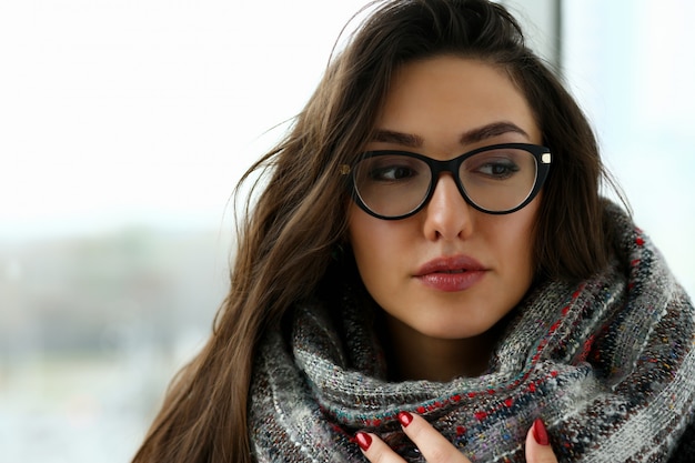 Young beautiful woman in a scarf portrait is