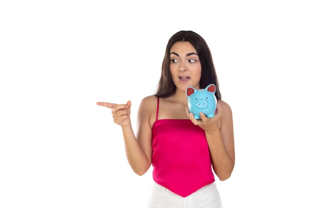 Young beautiful woman standing with piggy bank money box