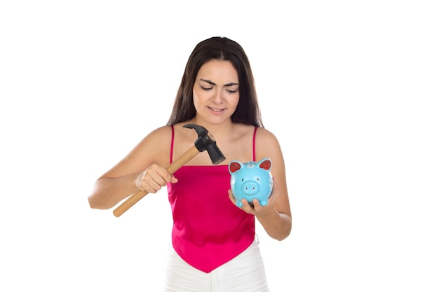 Young beautiful woman standing with piggy bank money box