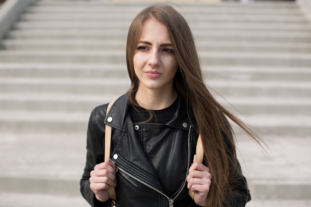 Young beautiful woman in a stylish outfit