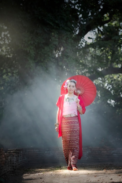 Young beautiful woman in Thai traditional dress 