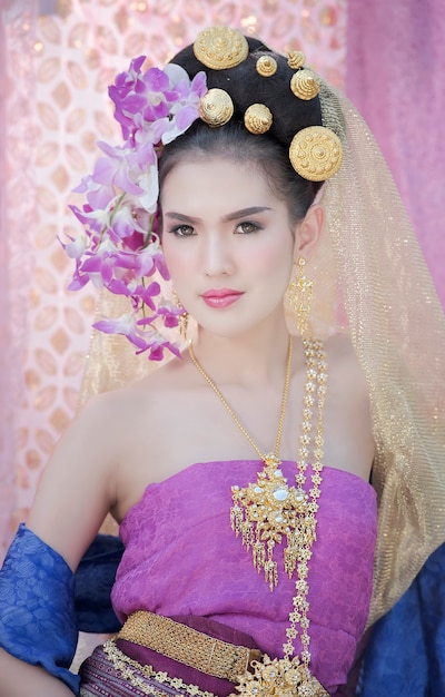 Young beautiful woman in Thai traditional dress 