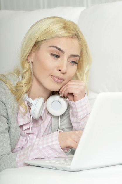 Young beautiful woman using a laptop computer at home