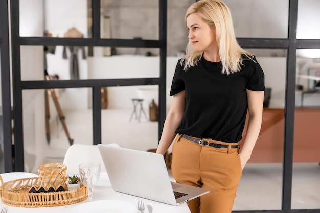 young beautiful woman using a laptop computer at home.