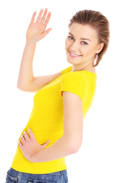 a young beautiful woman waving goodbye over white background