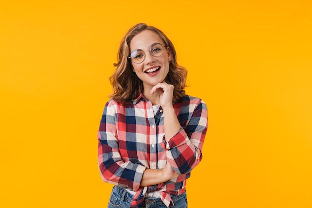 young beautiful woman wearing eyeglasses and plaid shirt smiling isolated