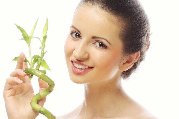 Young beautiful woman with bamboo