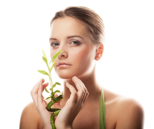 Photo young beautiful woman with bamboo