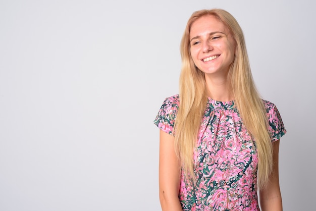 young beautiful woman with blond hair wearing floral dress