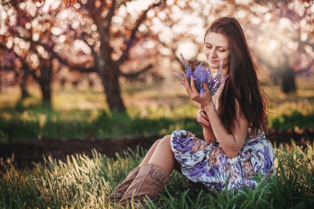 Young beautiful woman with a bouquet of lavender