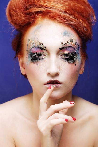 Young beautiful woman with colorful bright  make-up