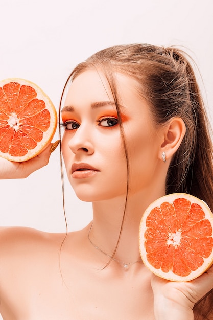 Young beautiful woman with fruits