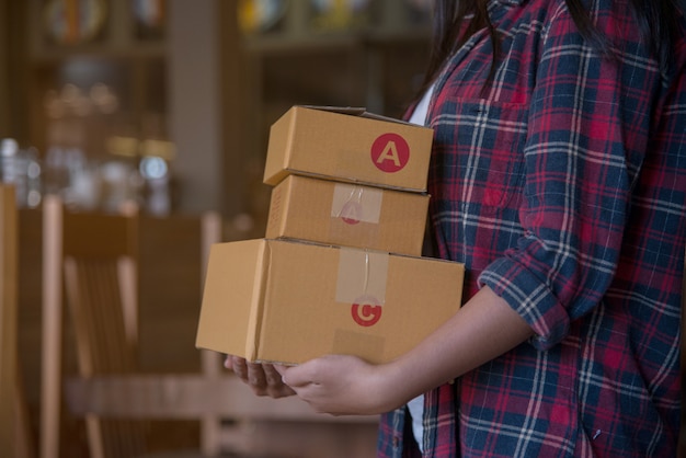 Young Beautiful woman with hold gift box in hands