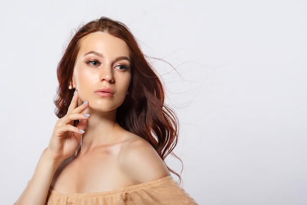 Young beautiful woman with long red hair