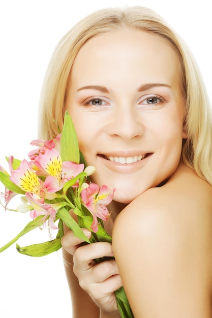 Young beautiful woman with pink flower