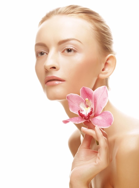 Young beautiful woman with pink flower