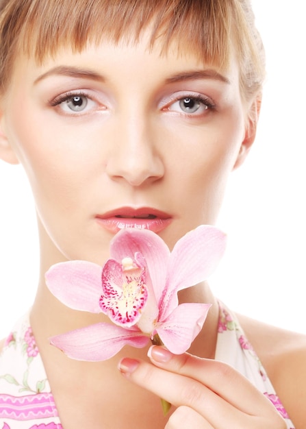 Young beautiful woman with pink flower