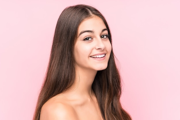 Young beauty caucasian woman on pink